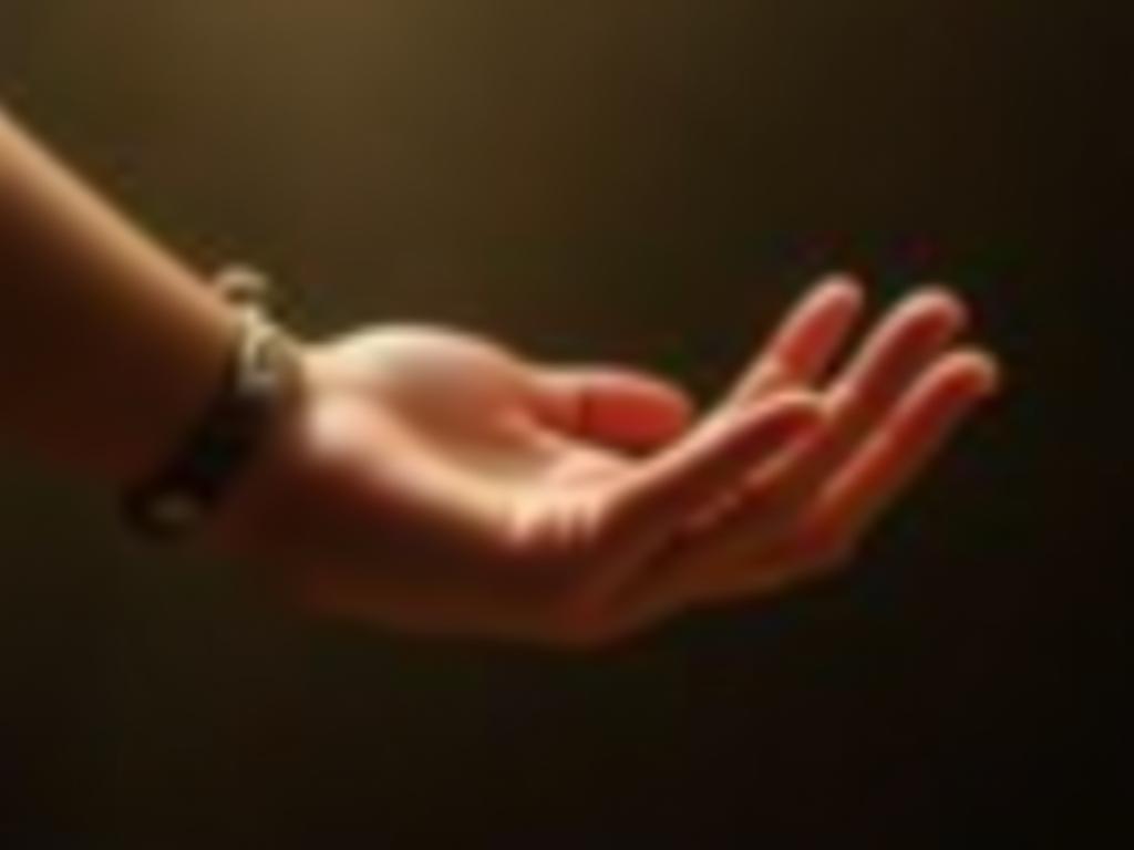 A person reaching out their hand, symbolizing vulnerability and connection. Warm lighting, soft focus.